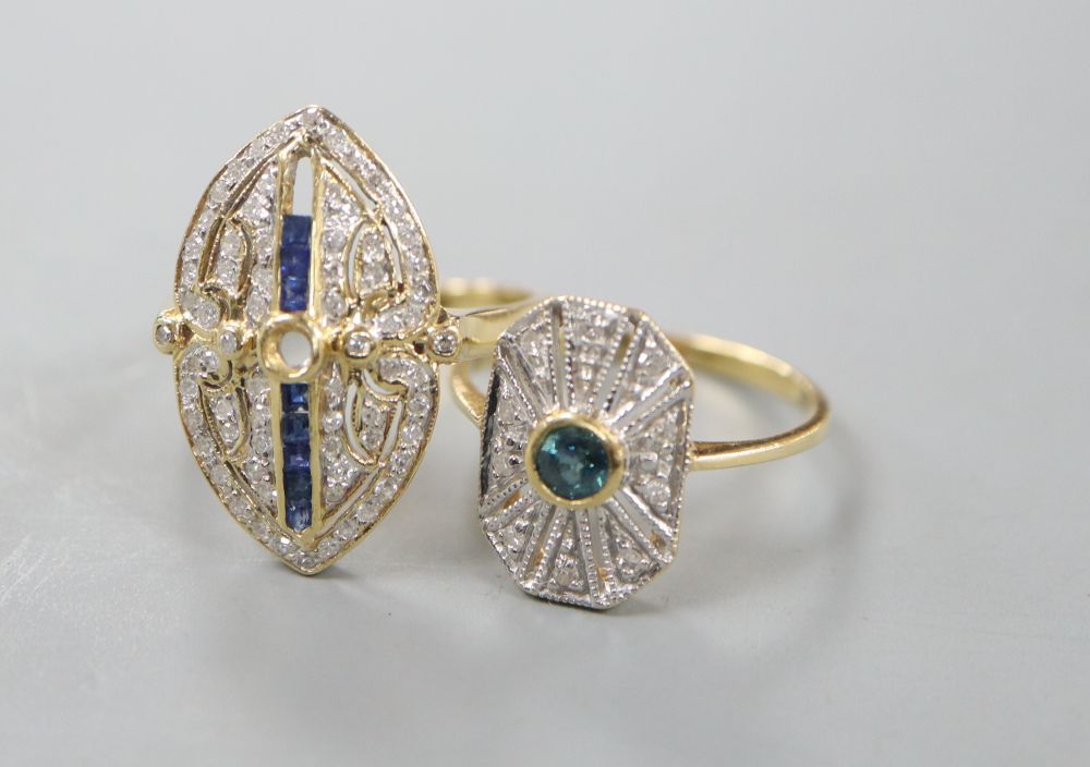 Two modern 18ct gold, sapphire and diamond set dress rings, (three stones missing from one), sizes M & O, gross 7.2 grams.